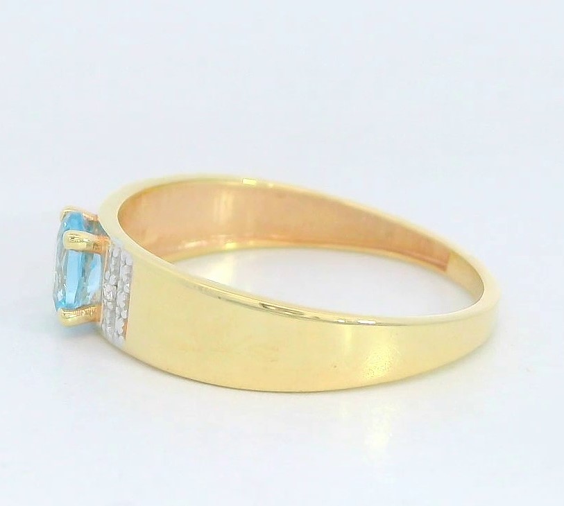 SORTIJA BICOLOR  CIRCONITA COLOR AGUA MARINA DE 5x4MM. 9 KILATES