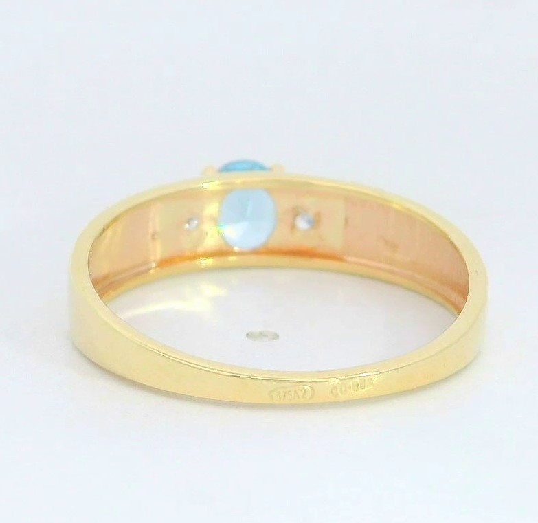 SORTIJA BICOLOR  CIRCONITA COLOR AGUA MARINA DE 5x4MM. 9 KILATES