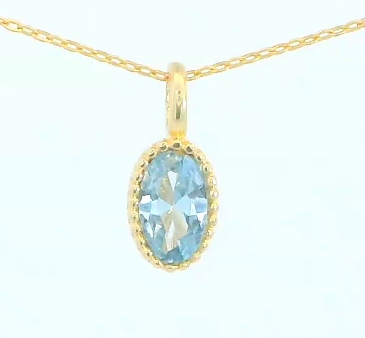COLGANTE OVAL 6X4MM COLOR AGUAMARINA.9 KILATES