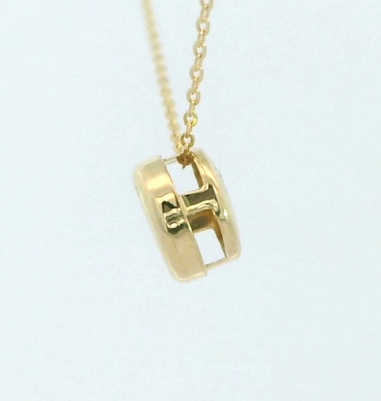 COLGANTE CHATON OR BLANCO ESTAMPACION 5MM.BRILLANTE H-SI 1. 0.05CT