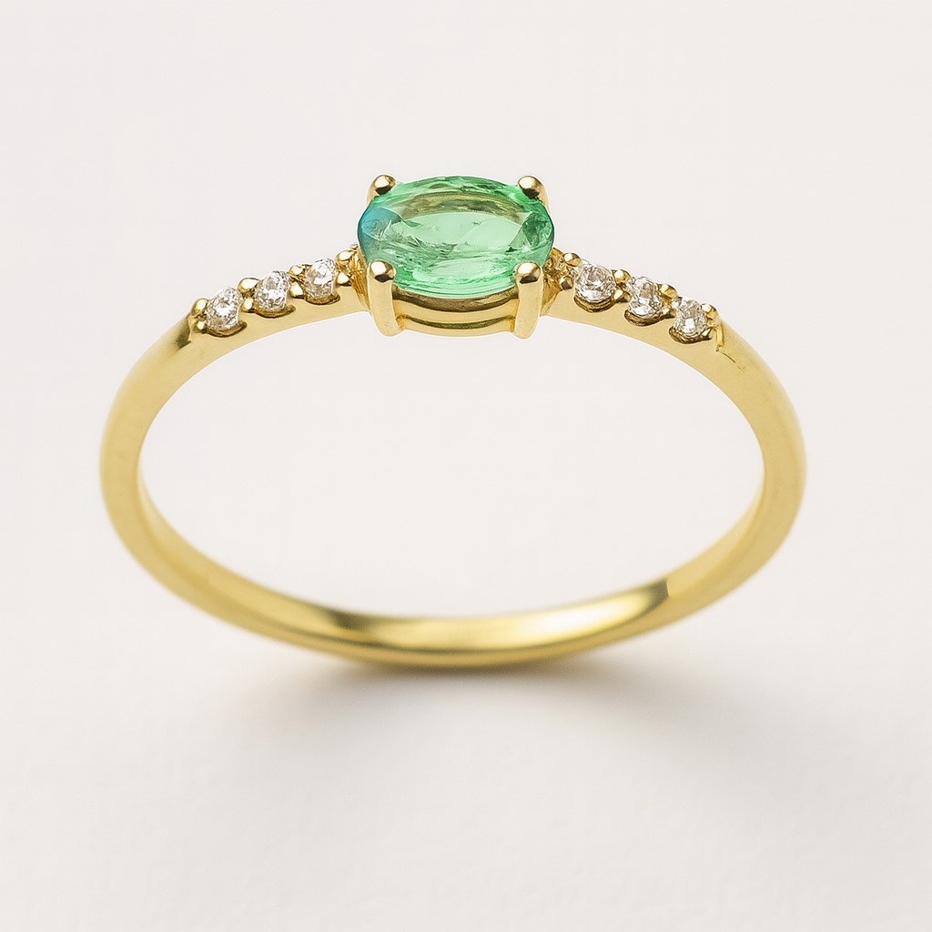 5x3MM  OVAL EMERALD AND CZ RING.