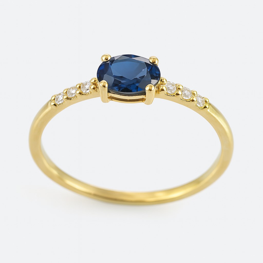 5x3MM OVAL SHAPPIRE AND CZ RING.