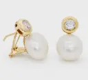 12MM BUTTON PEARL OMEGA BACK EARRINGS.