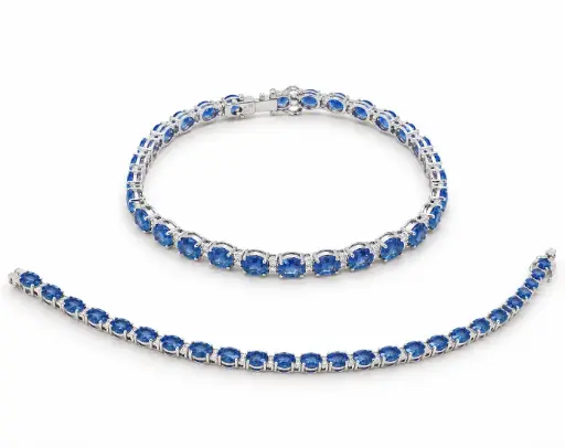 [B4260Z] 18CM WHITE GOLD RIVIERE BRACELET WITH DIAMONDS AND 10.62 CT TW SAPPHIRES.